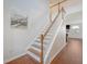 Elegant staircase featuring hardwood steps and white railings, connecting the home's levels with style at 143 Airy Dr, Summerville, SC 29486