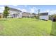 Expansive backyard featuring garden beds and a shed, perfect for outdoor activities at 145 Woodbrook Way, Moncks Corner, SC 29461