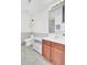 Bathroom features vanity with storage, large mirror, modern fixtures, and a window at 145 Woodbrook Way, Moncks Corner, SC 29461