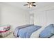Bright bedroom features a ceiling fan, closet, and neutral walls and plush carpet at 145 Woodbrook Way, Moncks Corner, SC 29461