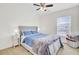 Cozy bedroom with natural light, neutral carpet, and a ceiling fan creates a relaxing and inviting space at 145 Woodbrook Way, Moncks Corner, SC 29461
