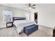 Comfortable main bedroom with a plush bed, carpeted floor, ceiling fan, and an organized walk-in closet at 145 Woodbrook Way, Moncks Corner, SC 29461