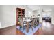 Spacious dining room with a large table for ten and a bookshelf at 145 Woodbrook Way, Moncks Corner, SC 29461