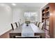 Dining room with an oversized table, seating for ten, hardwood floors, and a decorative hutch at 145 Woodbrook Way, Moncks Corner, SC 29461