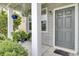 Charming front porch with decorative plants and a welcoming entrance at 145 Woodbrook Way, Moncks Corner, SC 29461