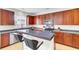 Well-equipped kitchen featuring stainless steel appliances, wood cabinets, and tiled breakfast bar at 145 Woodbrook Way, Moncks Corner, SC 29461