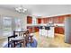 Eat-in kitchen area featuring dark cabinetry, stainless appliances, and a breakfast bar at 145 Woodbrook Way, Moncks Corner, SC 29461