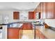 Spacious kitchen featuring wood cabinets, tiled breakfast bar and stainless steel appliances at 145 Woodbrook Way, Moncks Corner, SC 29461