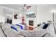 Comfortable living room features a sectional, fireplace, and a TV with a fountain showing on the screen at 145 Woodbrook Way, Moncks Corner, SC 29461
