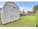 A storage shed in the backyard provides extra space for tools and equipment at 145 Woodbrook Way, Moncks Corner, SC 29461