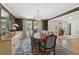 Dining room showcasing a beautiful table, large windows, and sophisticated design at 1511 Fairway Dr, Charleston, SC 29412