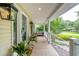 Charming front porch with ample space, stylish decor, and great curb appeal at 1511 Fairway Dr, Charleston, SC 29412