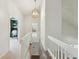 Hallway with chandelier, with view into office and bedroom at 1511 Fairway Dr, Charleston, SC 29412