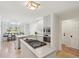 Bright kitchen features white cabinetry, stainless steel appliances, and a center island with cooktop at 1511 Fairway Dr, Charleston, SC 29412
