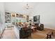 Bright open living room with vaulted ceiling, built-in bookshelves, and lots of seating at 1511 Fairway Dr, Charleston, SC 29412