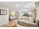 Combined living room and bedroom featuring neutral furniture and hardwood floors at 1511 Fairway Dr, Charleston, SC 29412
