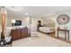 Open-concept space with a bedroom area and a living room area with television at 1511 Fairway Dr, Charleston, SC 29412