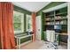 Bright office with custom built-in shelving and desk at 1511 Fairway Dr, Charleston, SC 29412