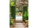 Beautiful pool with lush green landscape and stone waterfall feature in background at 1511 Fairway Dr, Charleston, SC 29412