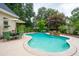 Inviting backyard with large pool, outdoor seating, and lush landscaping at 1511 Fairway Dr, Charleston, SC 29412