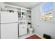Bright utility room with shelving, sink, window, and ample storage space at 1511 Fairway Dr, Charleston, SC 29412