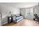 Comfortable bedroom featuring a cozy daybed, natural light from the window, and a work desk at 1530 Fort Johnson Rd # 1L, Charleston, SC 29412
