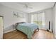 Inviting bedroom featuring a queen-sized bed, natural light, and a ceiling fan at 1530 Fort Johnson Rd # 1L, Charleston, SC 29412