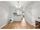 Bright dining area featuring hardwood floors and an open view to the kitchen at 1530 Fort Johnson Rd # 1L, Charleston, SC 29412