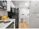 Efficient kitchen featuring white cabinets, granite countertops, and modern black appliances at 1530 Fort Johnson Rd # 1L, Charleston, SC 29412