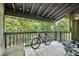 Covered patio with string lights and a view of the surrounding trees at 1530 Fort Johnson Rd # 1L, Charleston, SC 29412