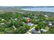 Aerial view of home in a neighborhood near the water with mature tree coverage at 1577 Periwinkle Dr, Mount Pleasant, SC 29466