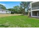 Large, grassy backyard with wood fence at 1577 Periwinkle Dr, Mount Pleasant, SC 29466