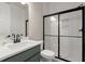Modern bathroom features white subway tile, a glass shower, and a dark vanity at 1577 Periwinkle Dr, Mount Pleasant, SC 29466