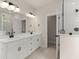Modern bathroom featuring double sinks, vanity, large mirror, and walk-in shower at 1577 Periwinkle Dr, Mount Pleasant, SC 29466