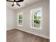Bright bedroom with hardwood floors and two white-framed windows at 1577 Periwinkle Dr, Mount Pleasant, SC 29466