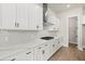 Well-lit kitchen featuring white cabinetry, quartz countertops, stainless steel appliances, and ample counter space at 1577 Periwinkle Dr, Mount Pleasant, SC 29466
