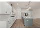 Contemporary kitchen with stainless steel appliances, modern lighting, and a green kitchen island at 1577 Periwinkle Dr, Mount Pleasant, SC 29466