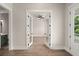 Bright living room with an open doorway, hardwood floors, and neutral walls at 1577 Periwinkle Dr, Mount Pleasant, SC 29466