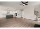 Open concept floor plan showcasing hardwood floors connecting kitchen and living spaces at 1577 Periwinkle Dr, Mount Pleasant, SC 29466
