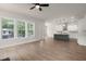 Open-concept living area with a view of the kitchen featuring pendant lighting and stainless steel appliances at 1577 Periwinkle Dr, Mount Pleasant, SC 29466