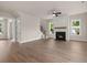 Open-concept living area with a fireplace, hardwood floors, and modern finishes at 1577 Periwinkle Dr, Mount Pleasant, SC 29466