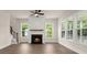Bright living room featuring a modern fireplace, ceiling fan and an abundance of natural light at 1577 Periwinkle Dr, Mount Pleasant, SC 29466