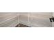 A bright pantry is equipped with white wire shelving and hardwood floors at 1577 Periwinkle Dr, Mount Pleasant, SC 29466