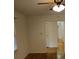 Bedroom with hardwood floors, fan, and view into the hallway at 1601 Westmoreland Ave, Charleston, SC 29412