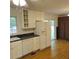 Eat-in kitchen with white cabinets, stainless steel appliances, and a sliding door at 1601 Westmoreland Ave, Charleston, SC 29412