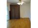 Spacious living room with hardwood floors, door and a large decorative cabinet at 1601 Westmoreland Ave, Charleston, SC 29412