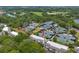 Aerial view of the community, tennis courts, lush landscaping, and a serene pond, highlighting the property's location at 1627 Live Oak Park, Seabrook Island, SC 29455