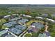 Aerial view of the community showcasing tennis courts and marsh views, highlighting the property's desirable setting at 1627 Live Oak Park, Seabrook Island, SC 29455