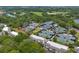 Aerial view of the community, tennis courts, lush landscaping, and a serene pond, highlighting the property's location at 1627 Live Oak Park, Seabrook Island, SC 29455