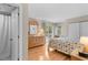 Bright bedroom featuring wood floors, a closet, and slider doors leading to the outdoors at 1627 Live Oak Park, Seabrook Island, SC 29455